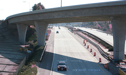 Photo of SR 52 overpass bridge crossing a two-way street below.